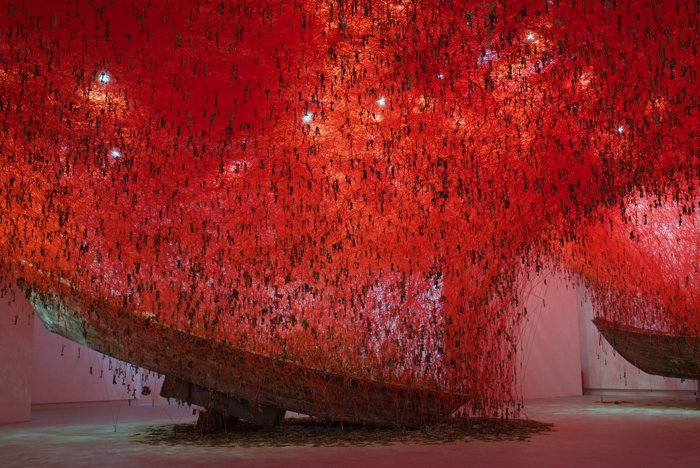 "The Key in the Hand", 2015, Old keys, old wooden boats, red wool, Venice, Italy, photo by Sunhi Mang